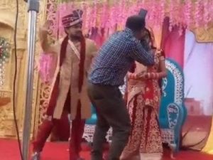 Groom beats cameraman