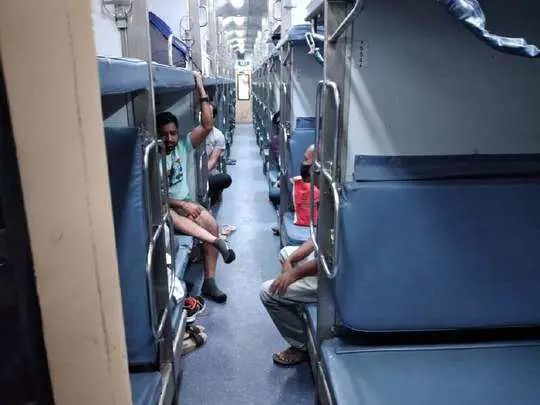 anyone can travel in AC bogie on sleeper class ticket